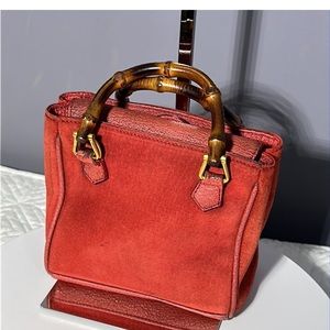Authentic Gucci mini bamboo handle red suede bag.